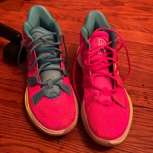 Used custom Kyrie sneakers in good condition.